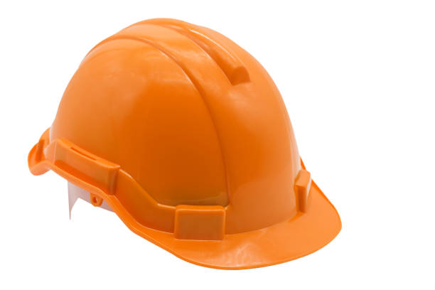istock Orange hard hat or helmet isolated on white 1283527756