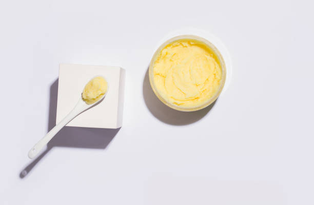 istock Cleansing scrub yellow. View from above. White background. Copy space 1283528302