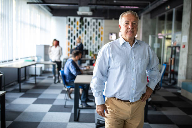 istock Confident senior businessman in modern coworking space 1283528332