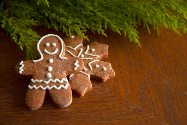 istock Christmas gingerbread and  snow shaped cookies on wooden table. 1283529967