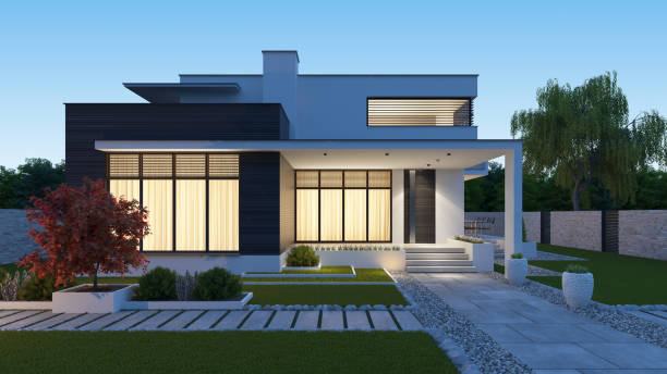 istock Luxurious beautiful modern villa with front yard garden at sunset. 1283532037