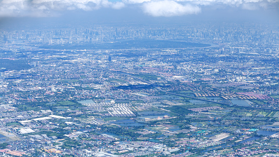 Departure flight over Bangkok with city skyline