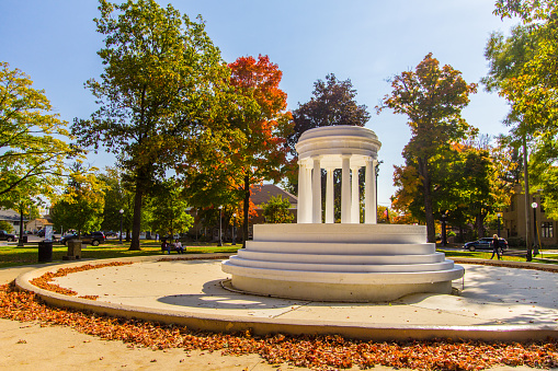 Marshall, Michigan, USA - October 9, 2020: Brooks Fountain in downtown Marshall. The fountain was unveiled in 1930, and is a Greek Revival style fountain that is a replica of Marie Antoinette's Temple of Love at Versailles, France.