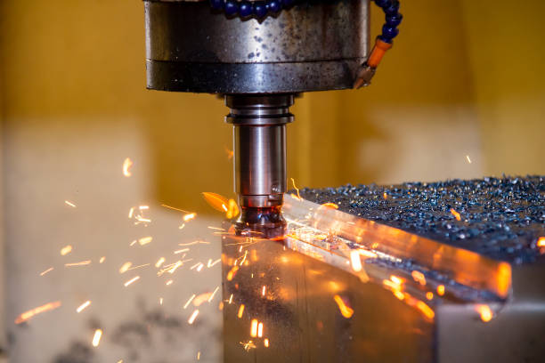 The burning chip from CNC milling machine rough cutting  by index-able  end-mill tools. stock photo