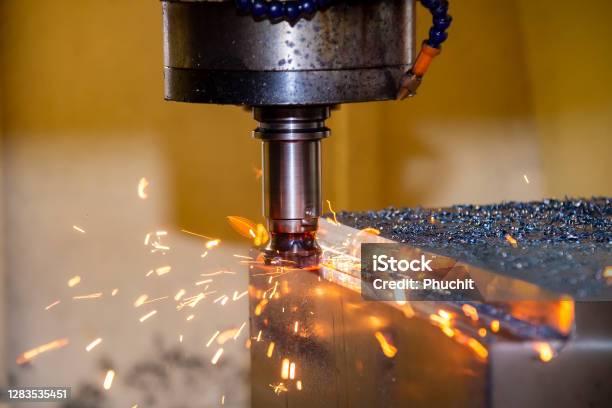 The Burning Chip From Cnc Milling Machine Rough Cutting By Indexable Endmill Tools Stock Photo - Download Image Now