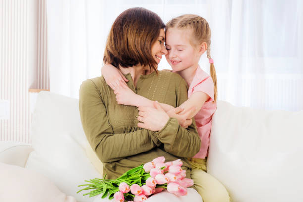 istock Child hugging mother with love 1283536631