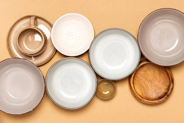 istock Many different ceramic dishes on a beige background top view. 1283536952