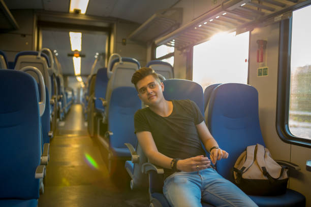 istock Young Man Traveling In Train 1283537875
