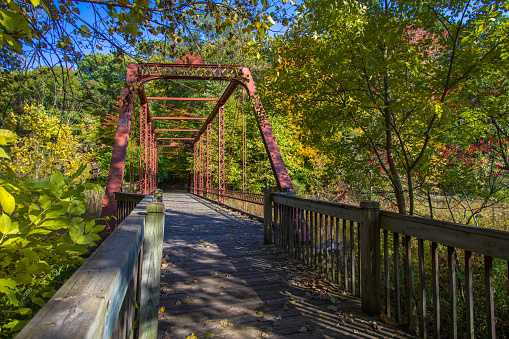 Historic steel truss bridge now serves as part of a hiking trail at the Historic Bridges Park in Battle Creek. The park incorporates historic bridges from the state of Michigan, that are slated for demolition and incorporates them into their hiking trails. This includes a portion of the North Country Trail that runs through the park.