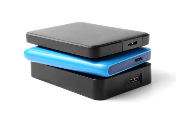 istock Several external drives SSD or HDD with a large amount of memory on a white background, close-up. 1283538304
