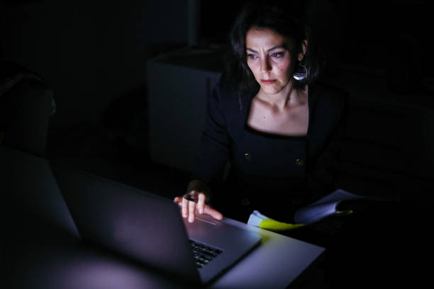 istock Business Person Working At Home At Night, Doing Homework At Night, Computer Research And Take 1283538633