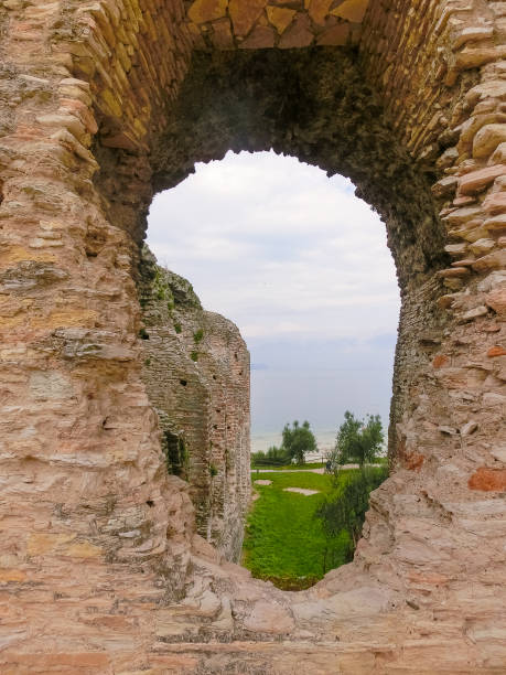 Ruins of Catullus Caves, roman villa in Sirmione, Garda Lake Sirmione, Italy - September 20, 2014: Ruins of Catullus Caves, roman villa in Sirmione, Garda Lake, Italy porticus stock pictures, royalty-free photos & images