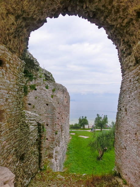 Ruins of Catullus Caves, roman villa in Sirmione, Garda Lake Sirmione, Italy - September 20, 2014: Ruins of Catullus Caves, roman villa in Sirmione, Garda Lake, Italy porticus stock pictures, royalty-free photos & images