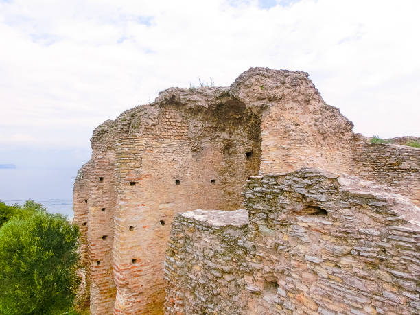 Ruins of Catullus Caves, roman villa in Sirmione, Garda Lake Sirmione, Italy - September 20, 2014: Ruins of Catullus Caves, roman villa in Sirmione, Garda Lake, Italy porticus stock pictures, royalty-free photos & images