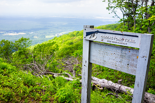 Lyndhurst, USA - June 9, 2020: Overlook sign and trailhead for Greenstone Trail at Blue Ridge parkway appalachian mountains in summer with nobody and scenic lush foliage