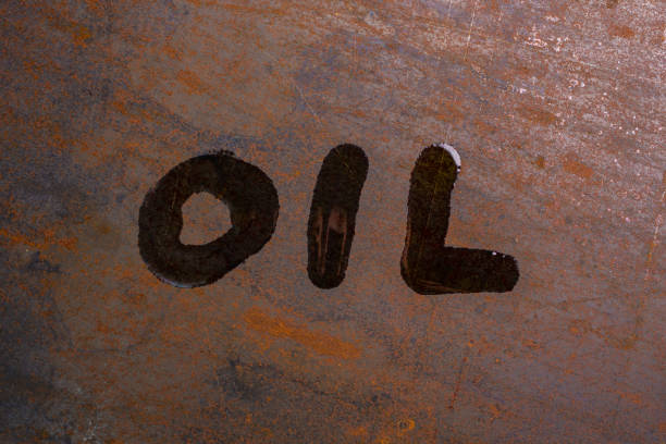 istock handwritten word oil on rusted sheet metal surface - close-up with selective focus 1283539701