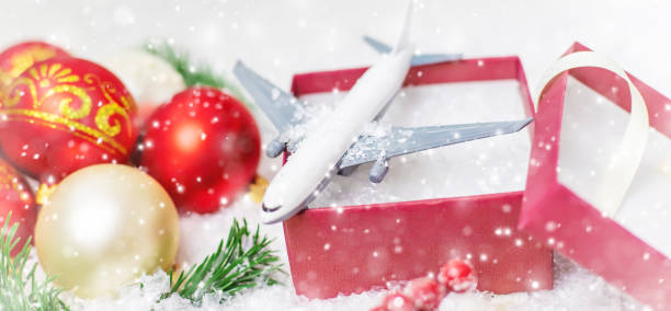 istock Travel for Christmas. Airplane with Christmas decor. Selective focus. 1283540335