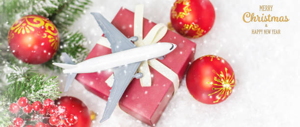istock Travel for Christmas. Airplane with Christmas decor. Selective focus. 1283540908