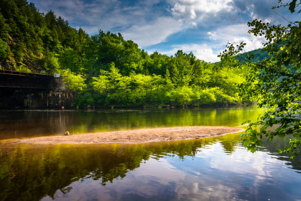 Evening clouds reflections in the Lehigh River, at Lehigh Gorge State Park, Pennsylvania stock photo