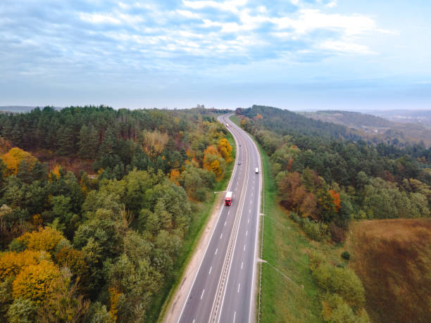 istock aerial view of autumn highway 1283543116