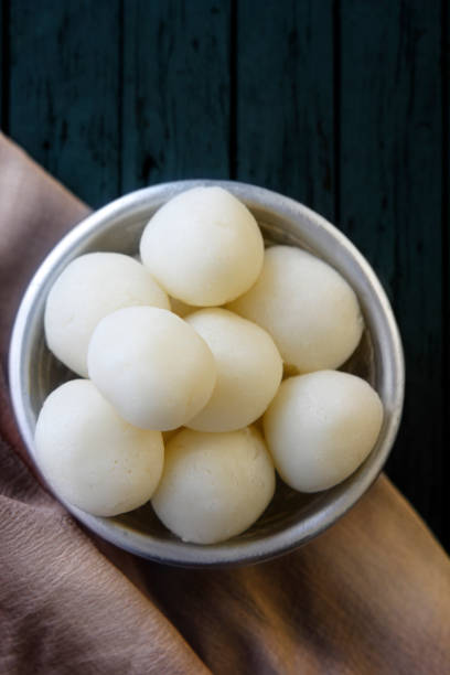 Indian Rasgulla or dry Rosogulla dessert/sweet served in a bowl Indian Rasgulla or dry Rosogulla dessert/sweet served in a bowl mithai stock pictures, royalty-free photos & images