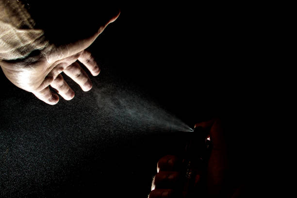 istock Spraying antibacterial agents on hands to prevent Covid-19. 1283545085