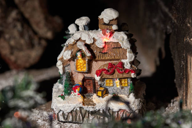 istock Toy fabulous Christmas house. Christmas composition on a dark background 1283546263