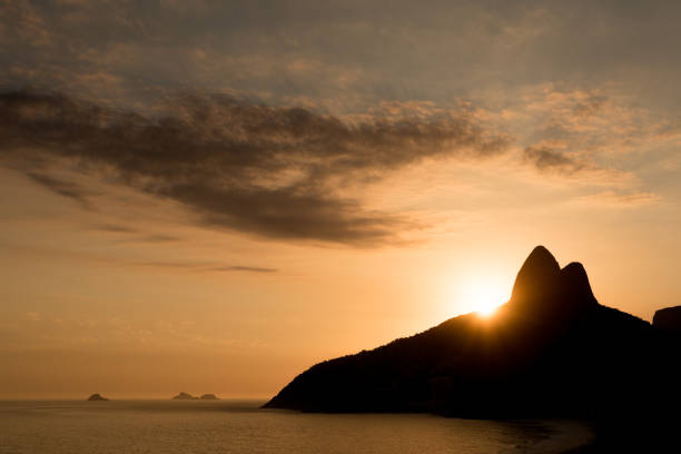 Silhouette of Two Brothers Mountain in Rio de Janeiro With Sun Setting Behind