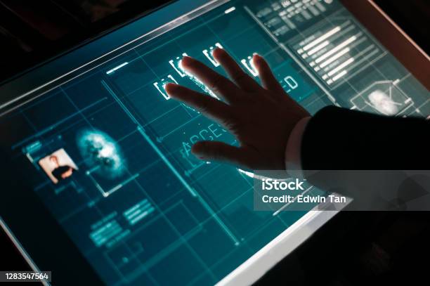 Hand Of Asian Chinese With Blazer Put On Scanner Device Screen For Security Check Access Stock Photo - Download Image Now