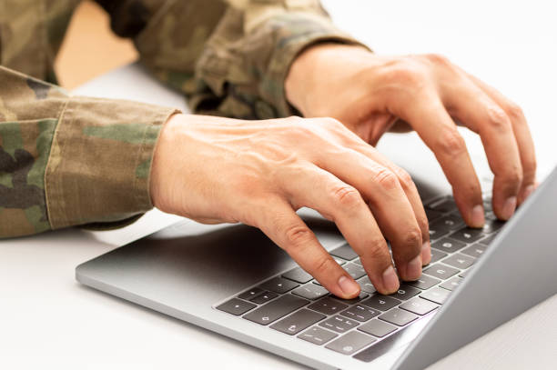 istock military typing on a laptop 1283548532