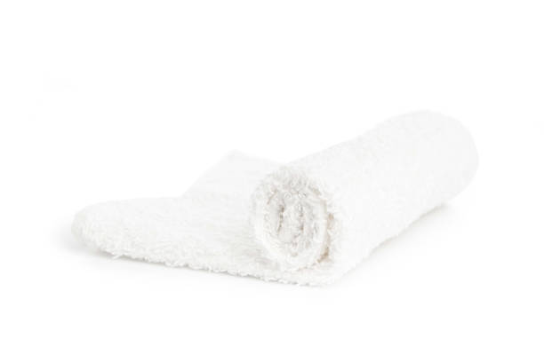 istock one white clean towel rolled up on a white background 1283549113