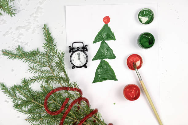 istock kids drawing, christmas tree and alarm clock 1283549741