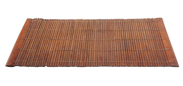 istock Brown bamboo food placemat isolated on white. 1283551285