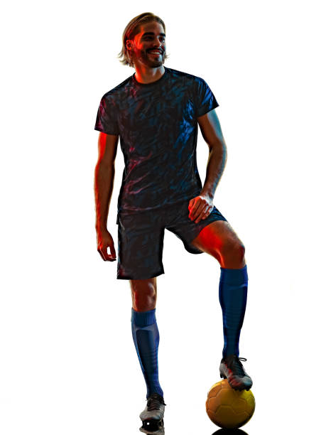 istock young soccer player isolated white background silhouette shadow 1283551372