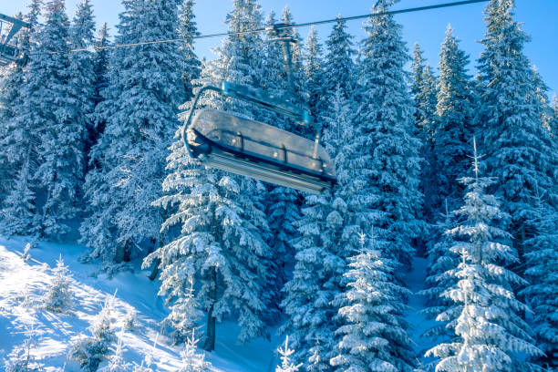 istock Empty Cabin of a Ski Lift and Morning Snowy Forest 1283551718