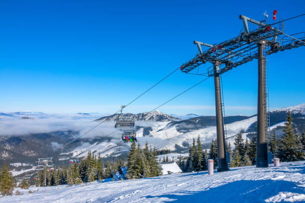 istock Chair Lift and Light Fog between Peaks 1283551726