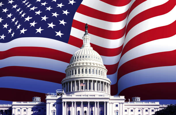 the US Capitol in Washington with the American flag waving in the background. the US Capitol in Washington with the American flag waving in the background. Patriotism and democracy. American presidential election. presidential election stock pictures, royalty-free photos & images