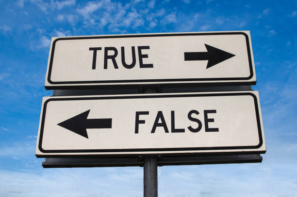istock True vs false. White two street signs with arrow on metal pole with word. Directional road. Crossroads Road Sign, Two Arrow. Blue sky background. Two way road sign with text. 1283552809