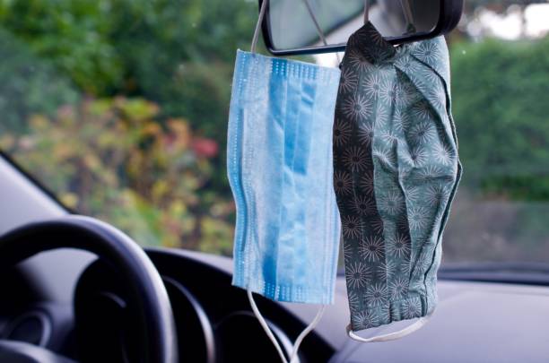 istock Two face masks in a car 1283553017