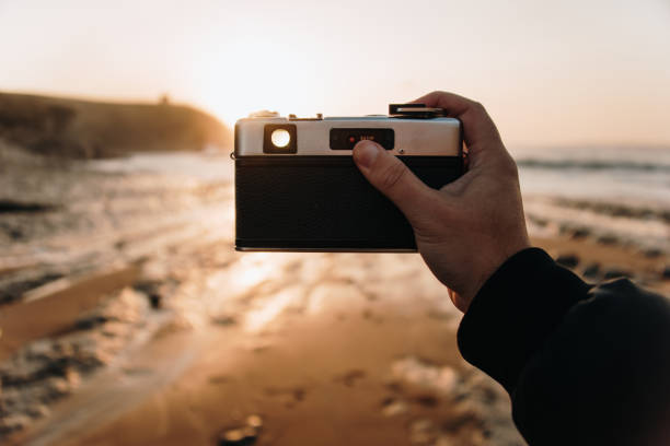 istock Taking a picture with a vintage film camera 1283555076
