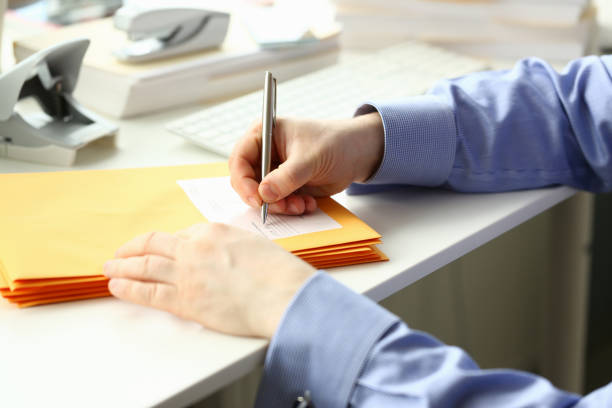 istock Male secretary working at desks in office 1283555465