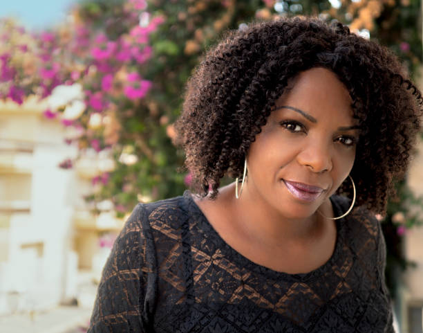 Portrait of lovely black mature woman with short hair.