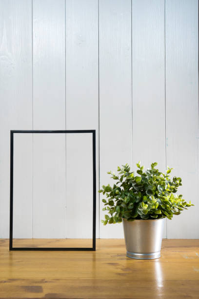 istock one blank black frame  and a plant pot 1283557337