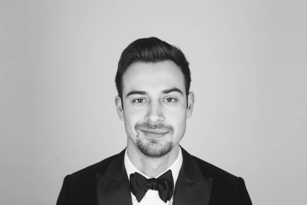istock Studio portrait of a young man in a tuxedo against plain studio background 1283559022