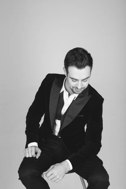 istock Studio portrait of a young man in a tuxedo against plain studio background 1283559044