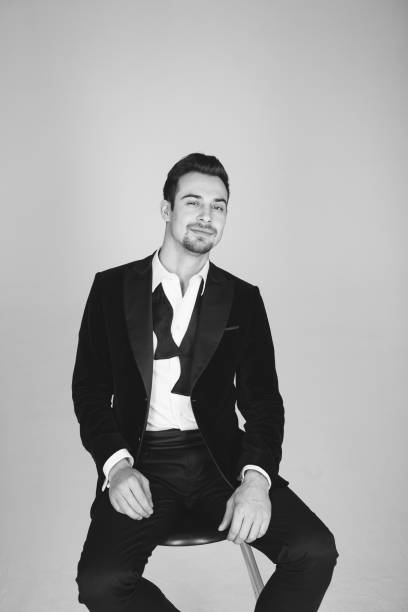 istock Studio portrait of a young man in a tuxedo against plain studio background 1283559048