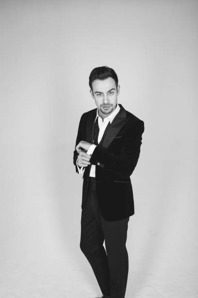 istock Studio portrait of a young man in a tuxedo against plain studio background 1283559050