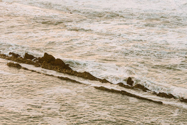 istock Rocks in the sea 1283560212