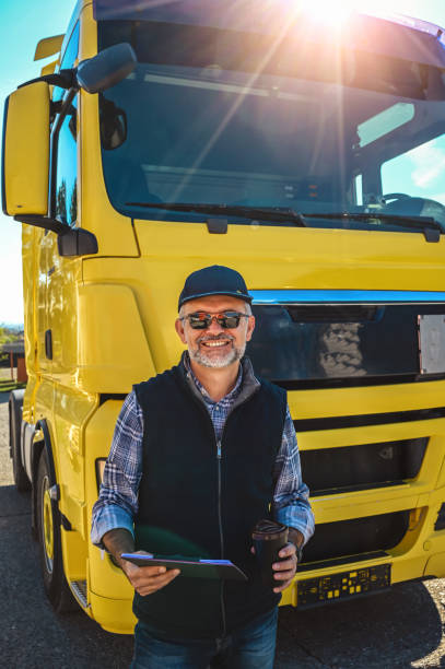istock Mature truck driver with clipboard 1283561621
