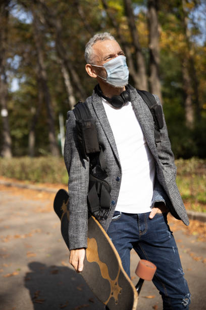 istock Mature handsome man in mask spending day outdoors 1283563889